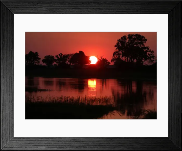 Framed Print : The sun sets over the Okavango Delta