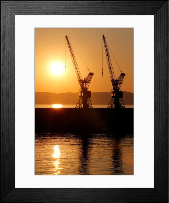 Framed Print : The sun sets behind loading cranes in the old harbour of Marseille Framed Print : The sun sets behind loading cranes in the old harbour of Marseille