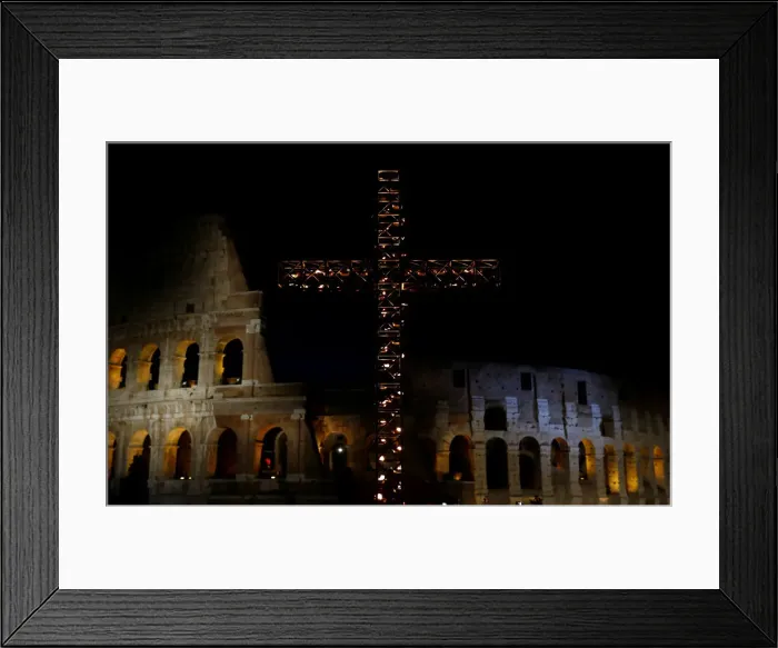 Framed Print : A cross lit up with candles is seen in front of the Colosseum before the Via Crucis Framed Print : A cross lit up with candles is seen in front of the Colosseum before the Via Crucis