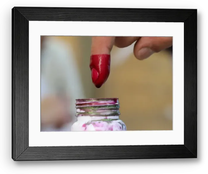 Framed Print : A voters finger is marked with ink at a polling station during the second day of Framed Print : A voters finger is marked with ink at a polling station during the second day of