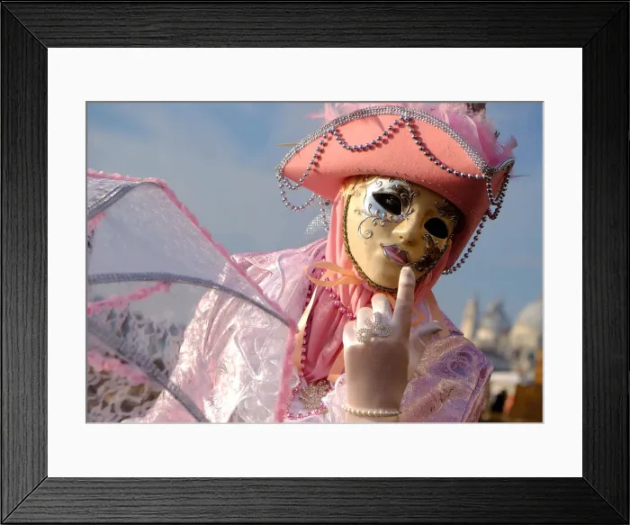 Framed Print : A masked reveller poses during the Venice Carnival