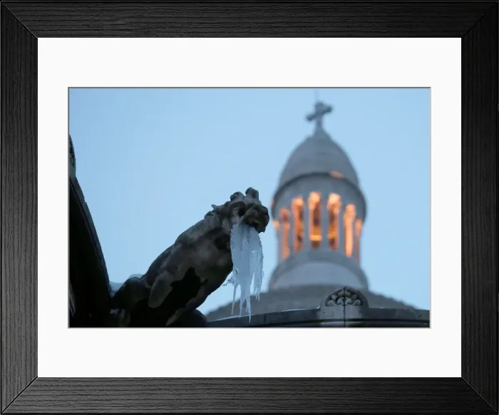 Framed Print : Icicles hang from a gargoyle on the Sacre Coeur basilica at the Butte Montmartre in Paris Framed Print : Icicles hang from a gargoyle on the Sacre Coeur basilica at the Butte Montmartre in Paris