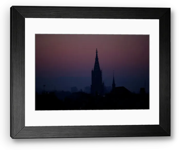 Framed Print : The sun rises behind the Muenster Cathedral during a cold morning in Bern Framed Print : The sun rises behind the Muenster Cathedral during a cold morning in Bern