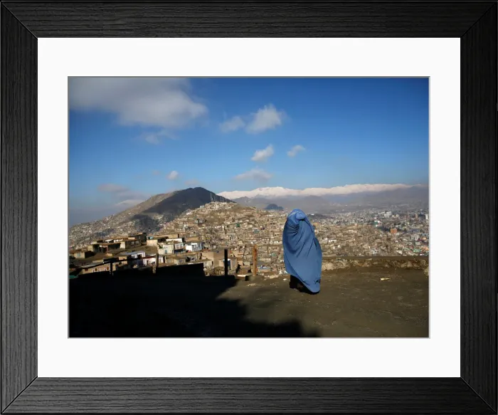 Framed Print : An Afghan woman walks on a hilltop overlooking Kabul Framed Print : An Afghan woman walks on a hilltop overlooking Kabul
