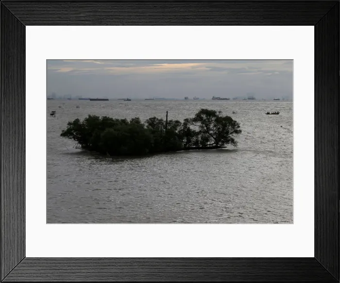 Framed Print : The Wider Image: Sinking shoreline threatens millions in Indonesia Framed Print : The Wider Image: Sinking shoreline threatens millions in Indonesia