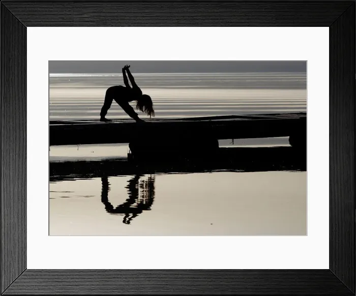 Framed Print : A girl practices yoga on the banks of Lake Ohrid in Ohrid Framed Print : A girl practices yoga on the banks of Lake Ohrid in Ohrid