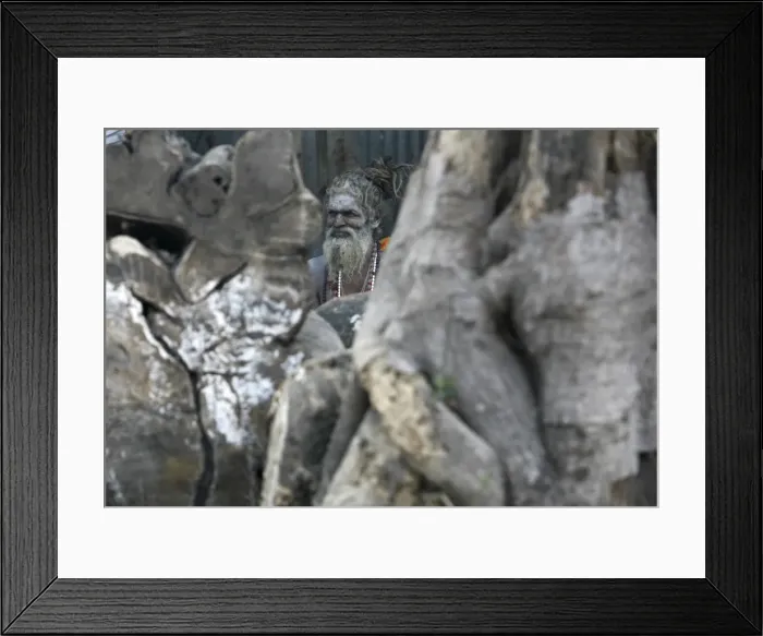 Framed Print : A Hindu monk rests in his makeshift shelter in Kolkata Framed Print : A Hindu monk rests in his makeshift shelter in Kolkata