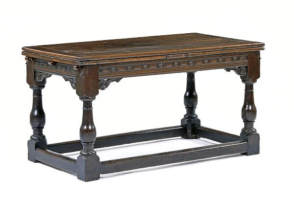 Table. Draw-leaf table made from oak with carved friezes, made in England c.1600-1650