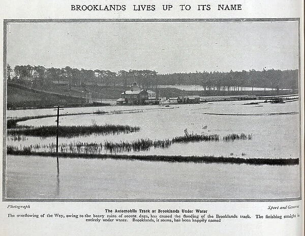 Photograph of flooding at Brooklands race track. Captioned, Brooklands lives up to its name'. With description, The Automobile Track at Brooklands Under Water; The overflowing of the Wey, owing to the heavy rains of recent days