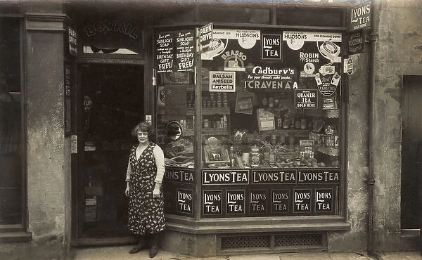 Woman standing outside a grocers shop