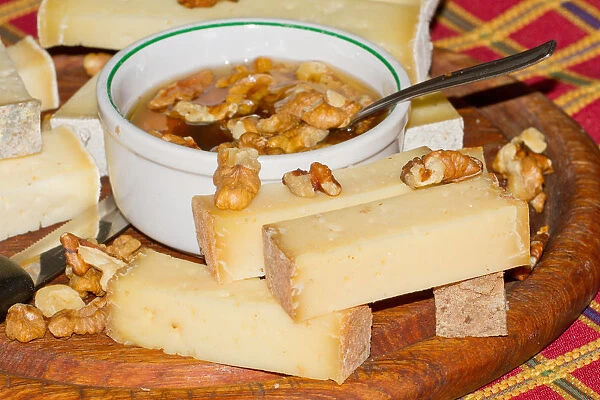 Honey, cheese and walnuts. Valtellina, Lombardy, Italy