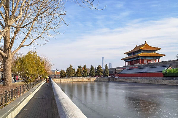 North Gate and moat of Forbidden City with CITIC Tower in background, Beijing, China