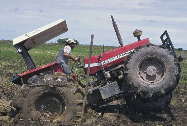 20068949. COLOMBIA Casanare Tractor stuck in a rice field owned by Lasmo Oil