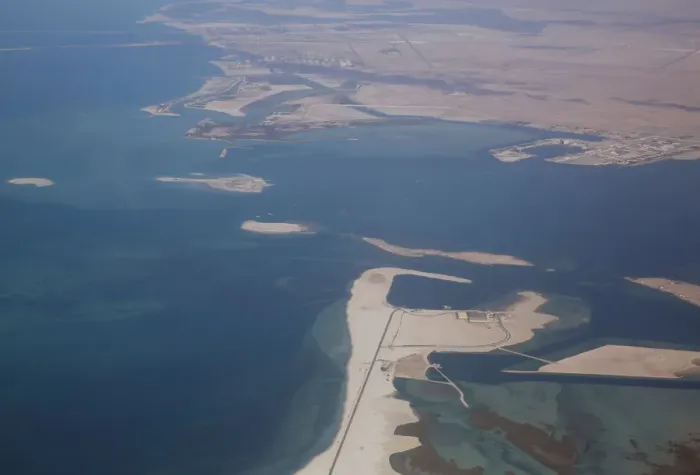 Framed Print : An aerial view of Arabian Gulf with city of Abu Dhabi is pictured through the window of Framed Print : An aerial view of Arabian Gulf with city of Abu Dhabi is pictured through the window of
