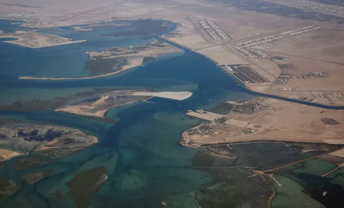 Framed Print : An aerial view of Arabian Gulf with city of Abu Dhabi is pictured through the window of Framed Print : An aerial view of Arabian Gulf with city of Abu Dhabi is pictured through the window of