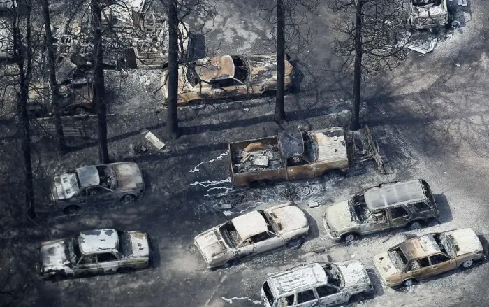 Framed Print : An aerial view of burned out vehicles in the aftermath of the Black Forest Fire in Black