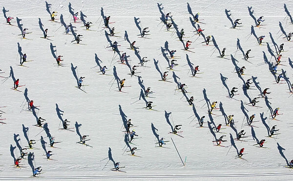 Aerial view of cross country skiers racing over the frozen Lake Sils during the Engadin