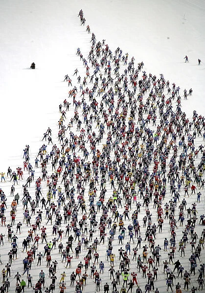 An aerial view of cross country skiers racing over the frozen lake Sils during the