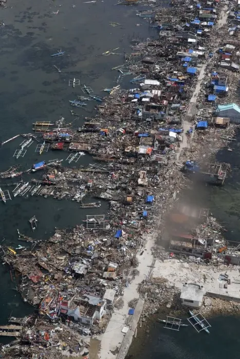 Framed Print : An aerial view of the devastation of super Typhoon Haiyan as it battered a town in Samar Framed Print : An aerial view of the devastation of super Typhoon Haiyan as it battered a town in Samar