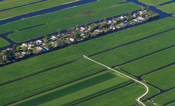 Aerial view of houses surrounded by water near Amsterdam