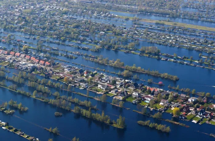 Framed Print : Aerial view of houses surrounded by water near Amsterdam