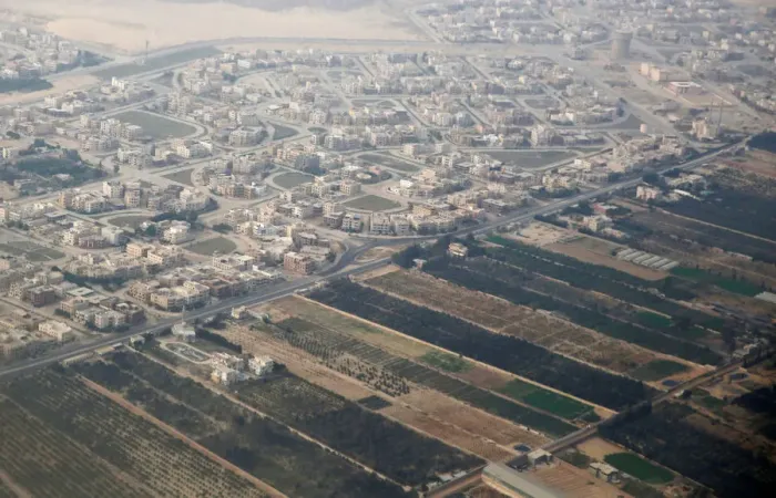 Framed Print : An aerial view of new housing complexes in a suburb of Cairo is pictured through Framed Print : An aerial view of new housing complexes in a suburb of Cairo is pictured through