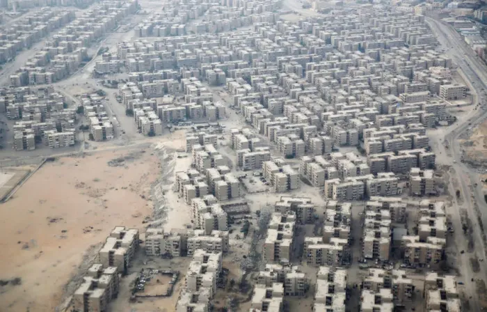 Framed Print : An aerial view of new housing complexes in a suburb of Cairo is pictured through Framed Print : An aerial view of new housing complexes in a suburb of Cairo is pictured through