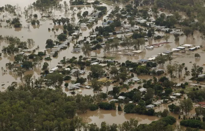 Framed Print : An aerial view of partially submerged houses in flooded Theodore in Australias state of