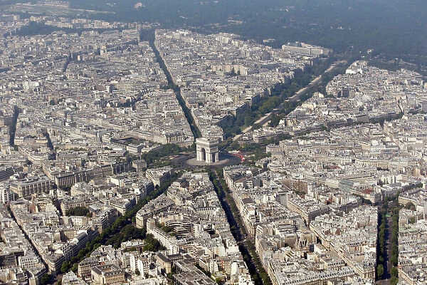 An aerial view shows the Arc de Triomphe and rooftops of residential buildings in