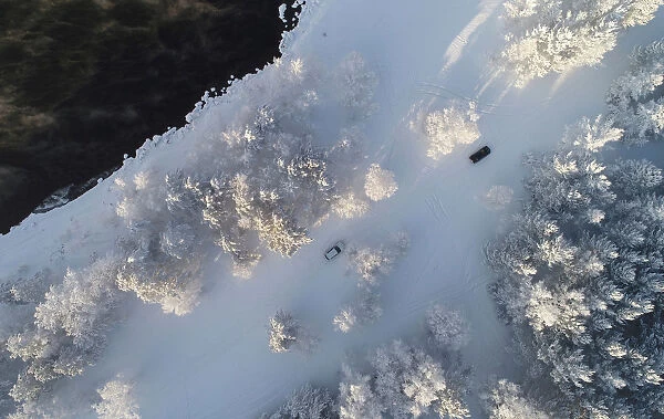 An aerial view shows cars driving along a bank of the Yenisei River outside Krasnoyarsk