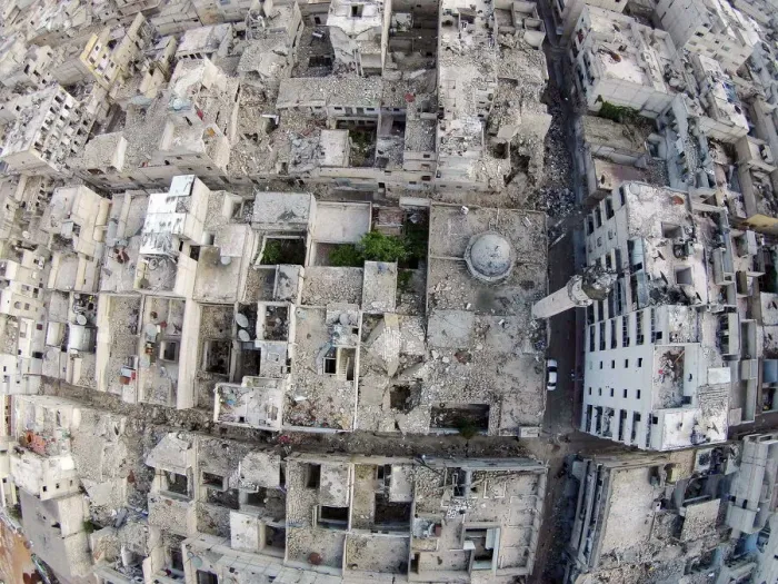 Framed Print : A aerial view shows a damaged mosque and surrounding buildings in the Al-Maysar Framed Print : A aerial view shows a damaged mosque and surrounding buildings in the Al-Maysar