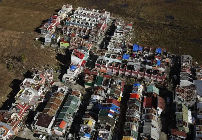 Framed Print : An aerial view shows houses damaged by Typhoon Haiyan, on the outskirts of Tacloban Framed Print : An aerial view shows houses damaged by Typhoon Haiyan, on the outskirts of Tacloban