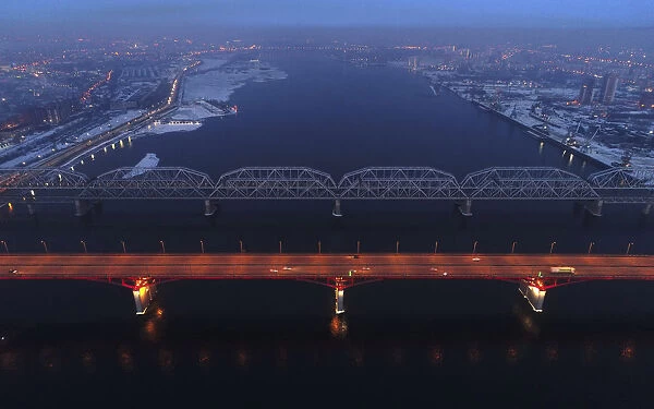 An aerial view shows the illuminated Nikolaevsky highway bridge
