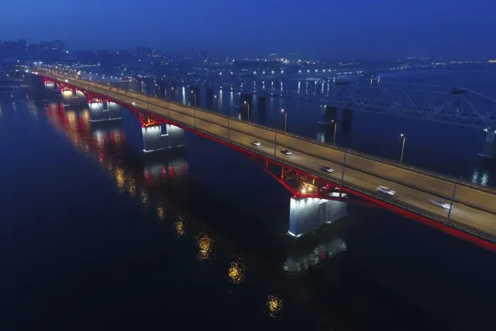 Framed Print : An aerial view shows the illuminated Nikolaevsky highway bridge