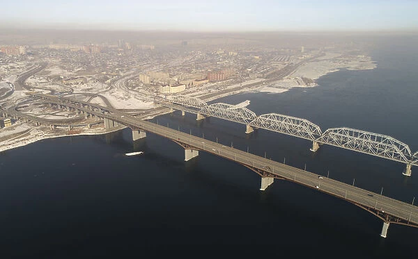 An aerial view shows the Nikolaevsky highway bridge and a bridge of the Trans-Siberian