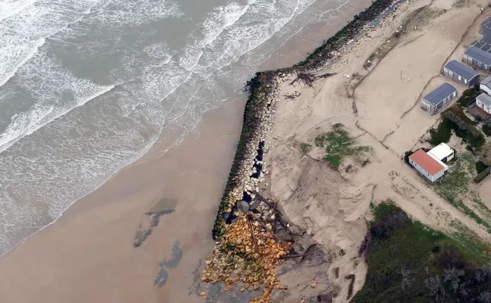 Framed Print : An aerial view shows sea walls on the beach that protect camping Framed Print : An aerial view shows sea walls on the beach that protect camping