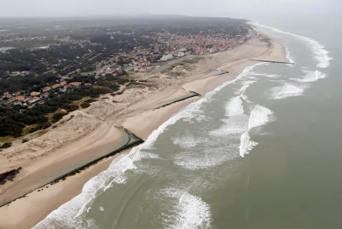 Framed Print : An aerial view shows sea walls on the beach that protect sand dunes from erosion along
