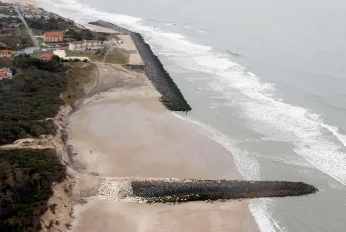 Framed Print : An aerial view shows sea walls on the beach that protect sand dunes from erosion along Framed Print : An aerial view shows sea walls on the beach that protect sand dunes from erosion along