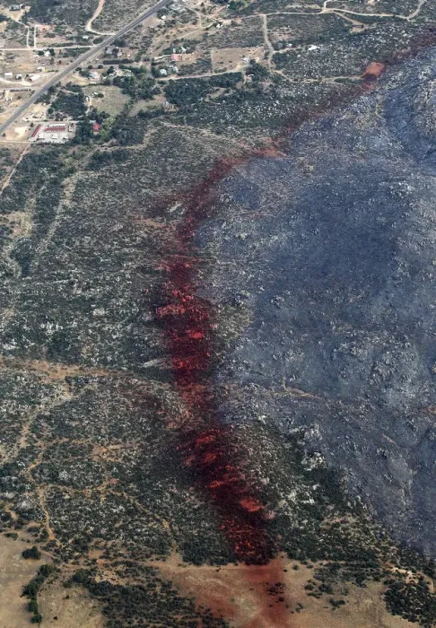Framed Print : An aerial view of a strip of fire retardant near Yarnell, Arizona