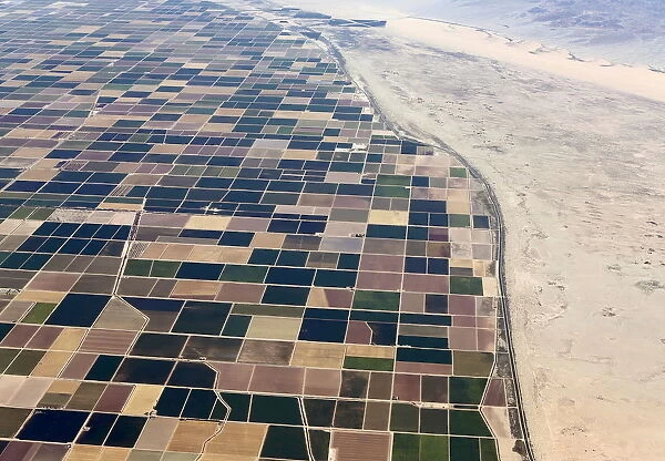Agricultural farm land is shown next to the desert in the Imperial valley near El Centro