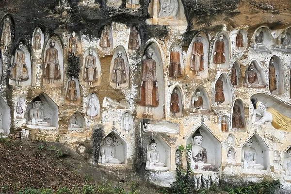 Akauk Taung Buddha cliff carvings pagodas are seen next to the UNESCO world heritage site