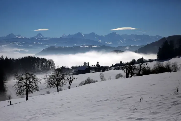 Framed Print : The Alps are seen behind fog near Bern