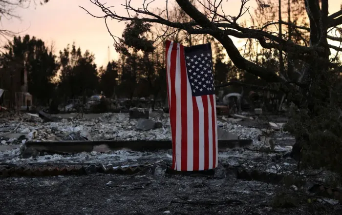 Framed Print : An American flag hangs from a tree in a neighborhood destroyed by wildfire in Santa Rosa Framed Print : An American flag hangs from a tree in a neighborhood destroyed by wildfire in Santa Rosa