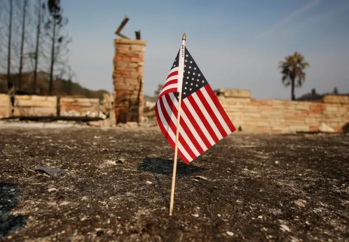 Framed Print : An American flag stands in front of a home destroyed after a wildfire tore through Santa Framed Print : An American flag stands in front of a home destroyed after a wildfire tore through Santa