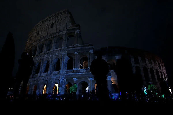 The ancient Colosseum is seen after the lights were switched off for Earth Hour in Rome