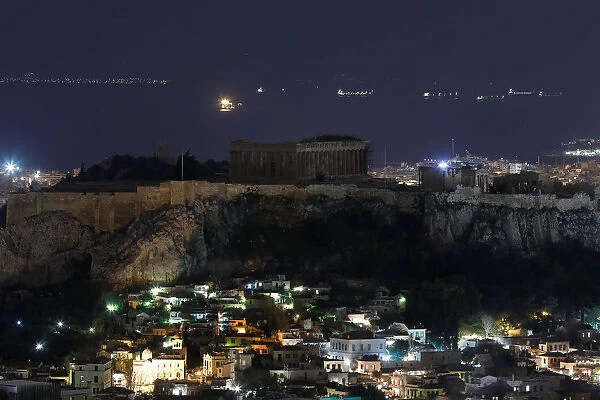 The ancient Parthenon temple is pictured atop the Acropolis hill during Earth Hour in