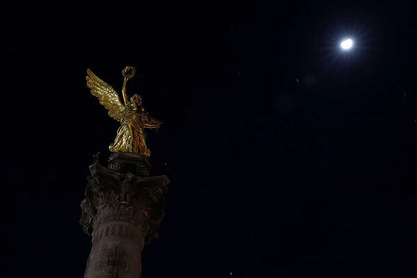 The Angel de la Independencia monument is pictured as lights are turned off during