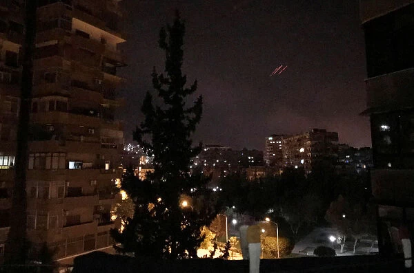 Anti-aircraft fire is seen over Damascus, Syria