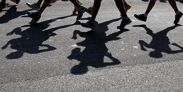 Athletes cast their shadows during the mens 20 kilometres race walk at the World