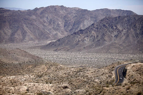 Automobile travels through California desert mountains